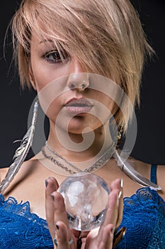 Modern Tribal Gypsy girl holding a crystal