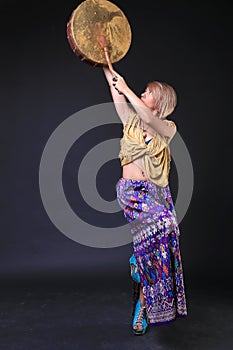 Modern Tribal Woman playing Elk drum