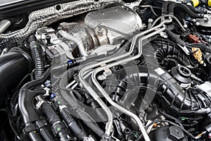 Modern turbo diesel car engine under vehicle hood. Car engine background. Car engine part. Modern powerful engine