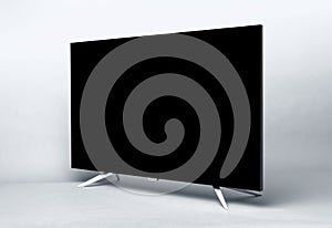 Modern TV or PC monitor on gray background.