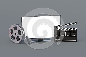 Modern tv with white isolated screen near clapper and movie reel