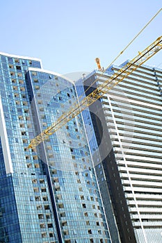 Modern unfinished buildings and a crane