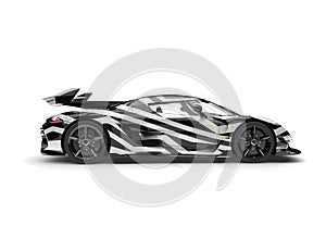 Modern unique supercar with black and white tribal paintjob