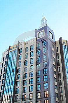 Modern urban architecture, rows of windows reflecting the sky.