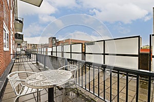 Modern Urban Balcony with Seating photo