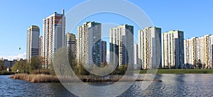 modern urban park with artificial lake and residential towers in front photo