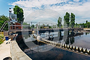 Modern urban sewage treatment plant. Sedimentation drainages round form photo