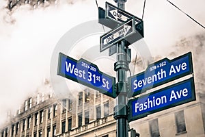 Modern urban street sign and vapor steam in New York City