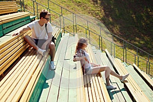 Modern urban young couple in the park, youth, love, dating