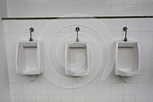 Modern urinal in men bathroom.