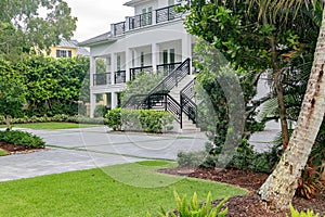 Modern vacation home with tropical landscaping in sunny Florida
