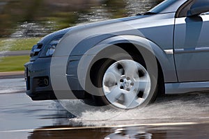 Modern Vehicle Driving on Wet Road