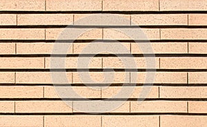 Modern vibrant yellow brick wall as a background image