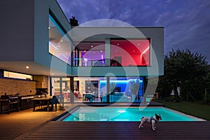 Modern villa with colored led lights at night