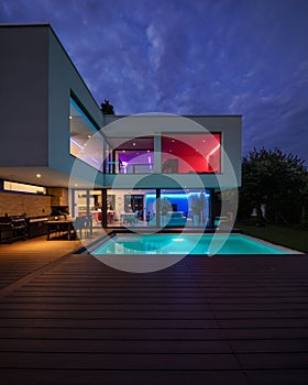 Modern villa with colored led lights at night