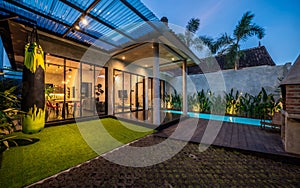 Modern villa, night scene, view from poolside