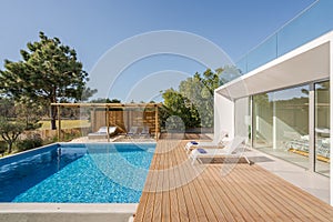 Modern villa with pool and deck with interior