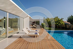 Modern villa with pool and deck with interior
