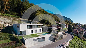 Modern villa with swimming pool, aerial view