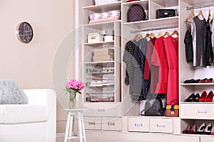 Modern wardrobe with stylish clothes