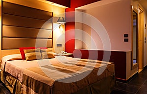 Modern, warm, inviting bedroom or hotel room. Light and shadows