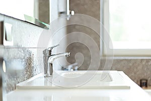 Modern washbasin with chrome faucet