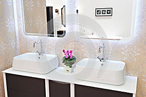 Modern washbasin, faucets in bathroom