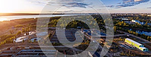 Modern wastewater treatment plant, aerial view from drone at the evening sunset