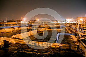 Modern wastewater treatment plant of chemical factory at night.