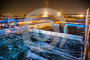 Modern wastewater treatment plant of chemical factory at night.