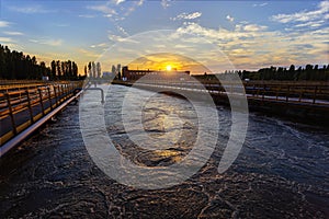 Modern wastewater treatment plant. Tanks for aeration and biological purification of sewage at sunset