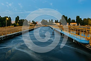 Modern wastewater treatment plant. Tanks for aeration and biological purification of sewage at sunset