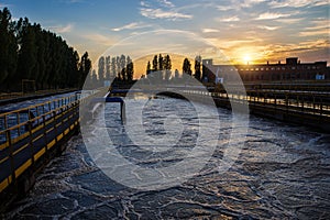 Modern wastewater treatment plant. Tanks for aeration and biological purification of sewage at sunset