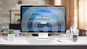 Modern web design page on computer display. Concept of web design studio work desk
