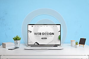 Modern website of web design company presented on a laptop computer photo