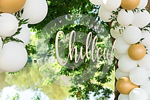 Modern wedding arch, inflatable balloons. inscription in gold chillout