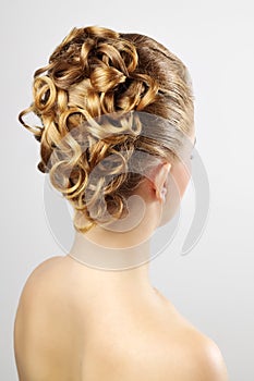 Modern wedding hairstyle. On gray