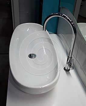 Modern white basin in the restroom