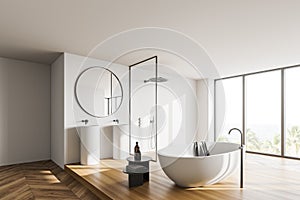 Modern white bathroom corner with sink and tub