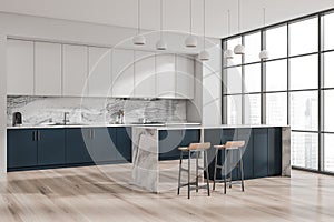 Modern white and blue kitchen. Corner view