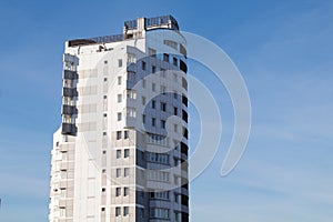 A modern white building against a blue sky