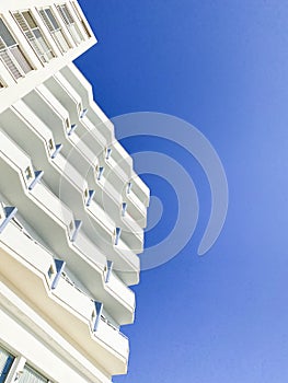 Modern white building on a blue background