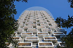 Modern white building in the city of Vancouver. Skyscraper block condo apartments