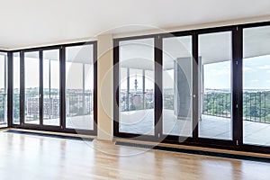 Modern white empty loft apartment interior with parquet floor and panoramic windows, Overlooking the metropolis city