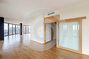 Modern white empty loft apartment interior with parquet floor and panoramic windows, Overlooking the metropolis city