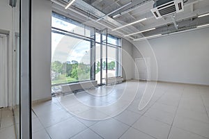 Modern white empty room interior with columns and panoramic windows.  room for office or store