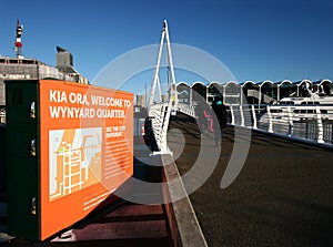 Modern white entry bridge of Wynyard Crossing with handrails in blue sky, Wynyard Quarter, Auckland, New Zealand