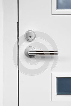 Modern white front door handle and lock