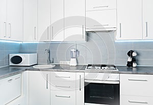 Modern white kitchen frontal view