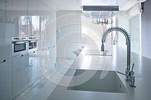 Modern white kitchen perspective with integrated bench